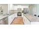 Beautiful kitchen featuring white cabinets, granite counters, and stainless appliances at 347 Carolina Hemlock Dr, Locust, NC 28097