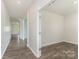 Bright room showcasing wood-look floors leading to other spaces at 347 Carolina Hemlock Dr, Locust, NC 28097