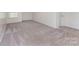 Spacious living room featuring plush carpet and ample natural light at 347 Carolina Hemlock Dr, Locust, NC 28097