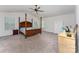 Spacious main bedroom featuring high ceiling, ceiling fan, carpet, and large windows at 347 Carolina Hemlock Dr, Locust, NC 28097