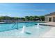 Community swimming pool featuring in-water fountains, lounge chairs, umbrellas and a covered patio area at 347 Carolina Hemlock Dr, Locust, NC 28097