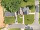 Aerial view of a well-maintained home with mature trees and landscaping at 5111 Clearwater Rd, Charlotte, NC 28217