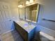 Bathroom with a double vanity, stylish mirrors, and modern fixtures at 5111 Clearwater Rd, Charlotte, NC 28217
