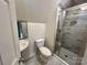 Bathroom featuring tiled shower, tile floor, modern fixtures, and sink at 5111 Clearwater Rd, Charlotte, NC 28217