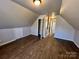 Large bedroom with neutral colors and hardwood flooring at 5111 Clearwater Rd, Charlotte, NC 28217