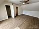 Spacious bedroom with ceiling fan and hardwood flooring. Lots of closet space at 5111 Clearwater Rd, Charlotte, NC 28217
