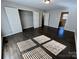 Spacious bedroom with hardwood floors and natural light, showcasing closet and bathroom access at 5111 Clearwater Rd, Charlotte, NC 28217