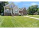 Charming home with a well-maintained lawn and inviting front porch at 5111 Clearwater Rd, Charlotte, NC 28217