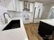 Contemporary kitchen featuring sleek countertops, stainless steel appliances, and a stylish sink at 5111 Clearwater Rd, Charlotte, NC 28217