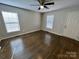 Inviting living room with hardwood floors, ample natural light, and ceiling fan at 5111 Clearwater Rd, Charlotte, NC 28217