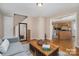 Spacious living room leads to kitchen and stairway, features hardwood floors and neutral decor at 5111 Clearwater Rd, Charlotte, NC 28217