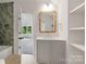 Modern bathroom showcasing a vanity with a square mirror and a tiled shower at 5127 Lansing Dr, Charlotte, NC 28270