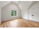 Bright bedroom with hardwood floors, large window, and double door closet at 5127 Lansing Dr, Charlotte, NC 28270