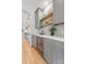 Stylish butler's pantry with gray cabinetry, open shelves, and a wine refrigerator at 5127 Lansing Dr, Charlotte, NC 28270