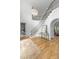 Sun-filled foyer with hardwood floors, chandelier lighting and grand staircase at 5127 Lansing Dr, Charlotte, NC 28270
