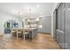 Open kitchen boasts a large island, marble countertops, light gray cabinetry, and stainless steel appliances at 5127 Lansing Dr, Charlotte, NC 28270