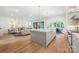 Open-concept kitchen features a large island, hardwood floors, and modern appliances at 5127 Lansing Dr, Charlotte, NC 28270