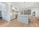 Spacious kitchen showcases light gray cabinets, marble countertops, a center island, and stainless steel appliances at 5127 Lansing Dr, Charlotte, NC 28270