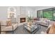 Bright living room with a modern fireplace, stylish decor, and comfortable seating at 5127 Lansing Dr, Charlotte, NC 28270