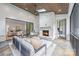 Cozy outdoor living area with fireplace, wood ceiling, stone floors, comfortable lounge furniture, and screened windows at 5127 Lansing Dr, Charlotte, NC 28270