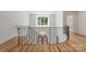Staircase with black iron railing and hardwood floors, viewed from above, showcases the architectural design at 5127 Lansing Dr, Charlotte, NC 28270