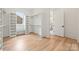 Walk-in closet with custom shelving, built-in bench, and hardwood floors offering ample storage space at 5127 Lansing Dr, Charlotte, NC 28270
