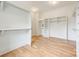 Walk-in closet with custom shelving and hardwood floors offering ample storage space at 5127 Lansing Dr, Charlotte, NC 28270
