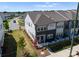 Aerial view of modern gray and white townhouses, showcasing community layout at 5481 Comiskey Aly, Kannapolis, NC 28081