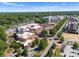 Aerial view captures downtown community with brick buildings, church, and commercial spaces at 5481 Comiskey Aly, Kannapolis, NC 28081