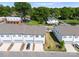 Aerial view of townhomes shows modern construction and landscaping in a community setting at 5481 Comiskey Aly, Kannapolis, NC 28081