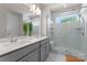 Sleek bathroom with marble-style shower, dual vanity, and contemporary lighting at 5481 Comiskey Aly, Kannapolis, NC 28081