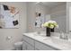 Bathroom featuring a double sink vanity with quartz countertop and decorative accents at 5481 Comiskey Aly, Kannapolis, NC 28081