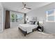 Bright bedroom features a ceiling fan, large windows, and neutral decor for a relaxing atmosphere at 5481 Comiskey Aly, Kannapolis, NC 28081