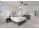 Cozy bedroom with soft carpeting, a comfortable bed, and a stylish dresser at 5481 Comiskey Aly, Kannapolis, NC 28081