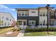 Charming townhome featuring a manicured lawn, white picket fence and a blend of modern and traditional design elements at 5481 Comiskey Aly, Kannapolis, NC 28081