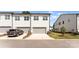 Modern townhome with gray garage door, manicured lawn, and a clean, contemporary design at 5481 Comiskey Aly, Kannapolis, NC 28081
