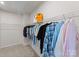 Spacious walk-in closet with ample hanging space and shelving for organized storage at 5481 Comiskey Aly, Kannapolis, NC 28081