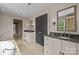 Bathroom with double vanity, marble countertops, and modern fixtures at 640 Colville Rd, Charlotte, NC 28207