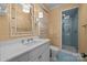 Light and bright bathroom with a patterned shower and a white vanity at 640 Colville Rd, Charlotte, NC 28207