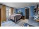 Bedroom with carpet, large window, and blue walls at 640 Colville Rd, Charlotte, NC 28207