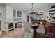 Breakfast nook area with custom banquette seating, ample storage and wine fridge at 640 Colville Rd, Charlotte, NC 28207