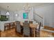 Charming dining area featuring a chandelier, wooden table, and stylish seating at 640 Colville Rd, Charlotte, NC 28207
