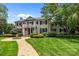 Charming two-story home featuring manicured landscaping and a stone walkway leading to the front entrance at 640 Colville Rd, Charlotte, NC 28207