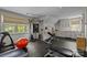 Home gym featuring state-of-the-art exercise equipment and ample natural light at 640 Colville Rd, Charlotte, NC 28207