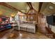 Rustic living room with wood paneling, skylights, and a comfortable sectional sofa at 640 Colville Rd, Charlotte, NC 28207