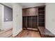 Spacious mudroom with custom wood built-ins, cubbies, and bench seating at 640 Colville Rd, Charlotte, NC 28207