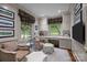 Home office with built-in cabinetry, desk space, and natural light from large windows at 640 Colville Rd, Charlotte, NC 28207