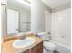 Bathroom featuring a vanity, toilet, and shower-tub combination with tile surround at 673 Shellbark Dr, Concord, NC 28025