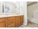 Full bathroom with double sinks, wood cabinets, and a shower-tub combination at 673 Shellbark Dr, Concord, NC 28025