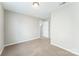 Carpeted bedroom featuring a closet and a neutral color palette for easy customization at 673 Shellbark Dr, Concord, NC 28025